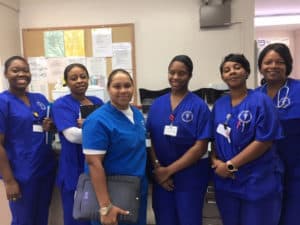 CDI Students Smiling in their Scrubs