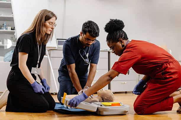 Students practicing clinical skills at a California vocational nursing school