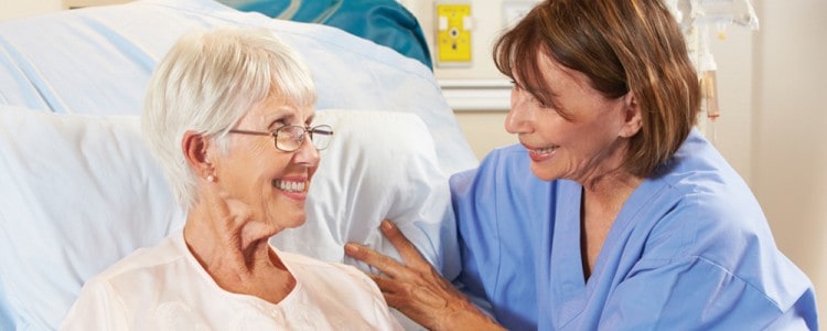 Nurse smiling with a patient